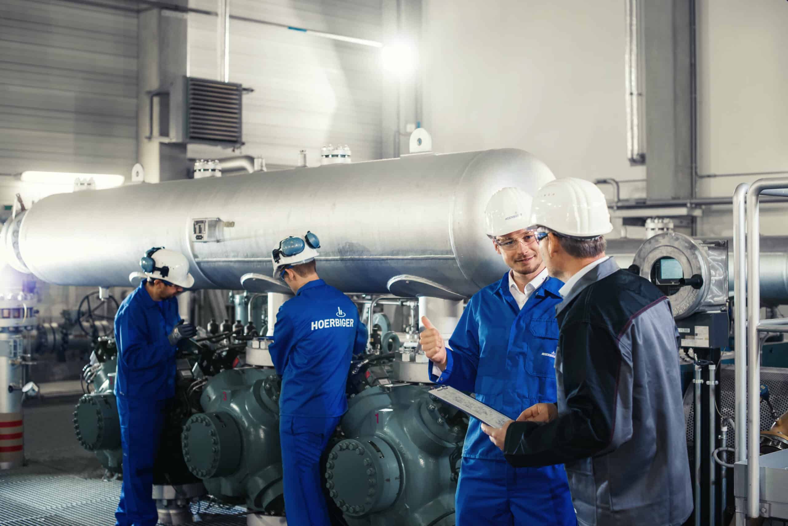 Hoerbiger workers with helm